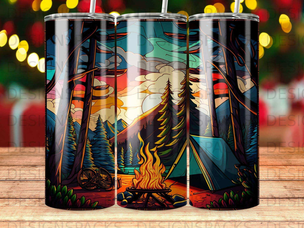 Tent and campfire in a forest at sunset, with mountains and bike.