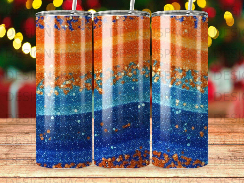 Blue and orange glitter gradient tumbler with bokeh lights background.