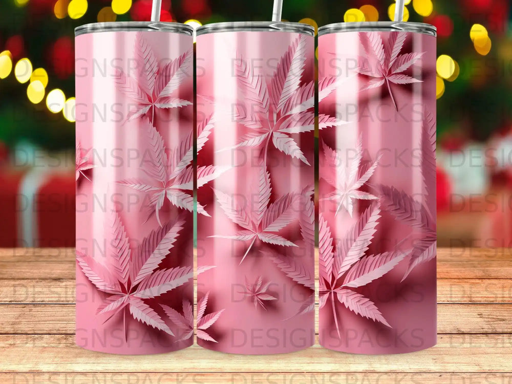 Three pink tumblers with a repeating leaf pattern, set against a bokeh background.