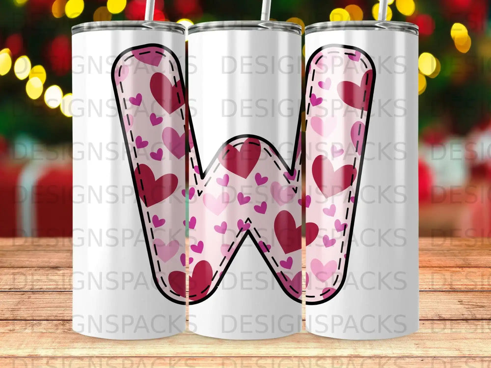 Tumbler with repeating pink and red heart pattern and a large "W" cutout.