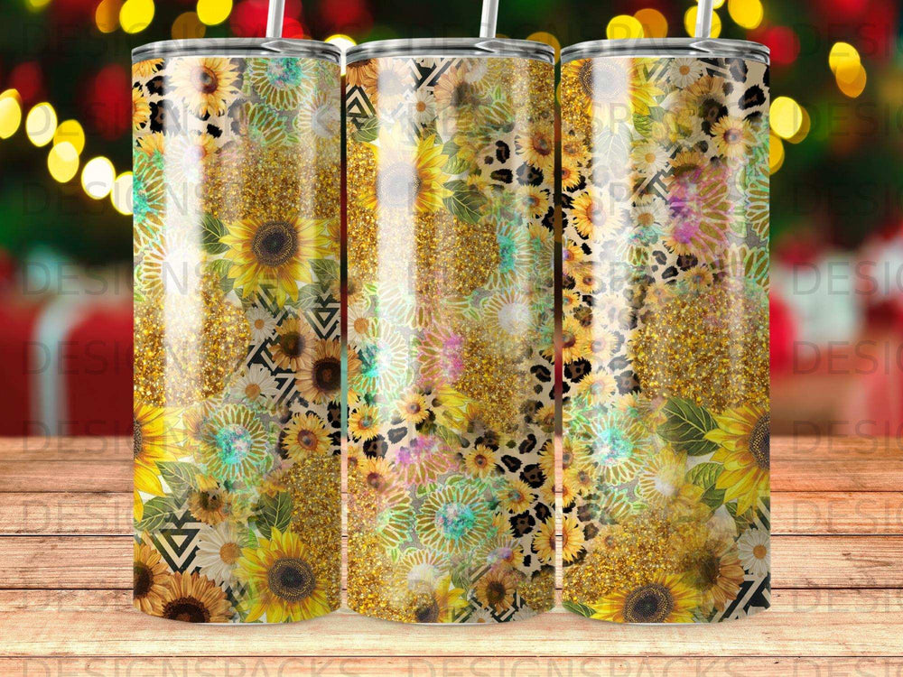 Three tumblers with sunflower, leopard print, and glitter designs.