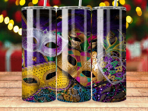 Three ornate, colorful Mardi Gras masks adorned with beads and feathers.