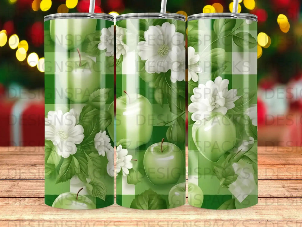 Green plaid tumbler with white flowers and apples.