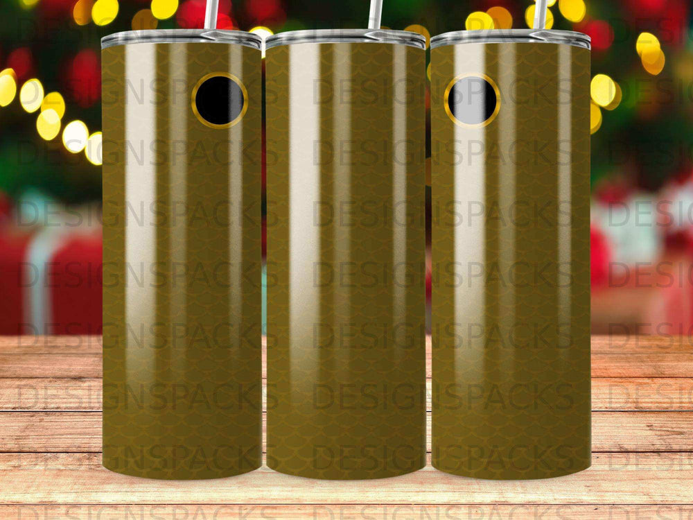Three patterned tumblers with straws on a dark background.
