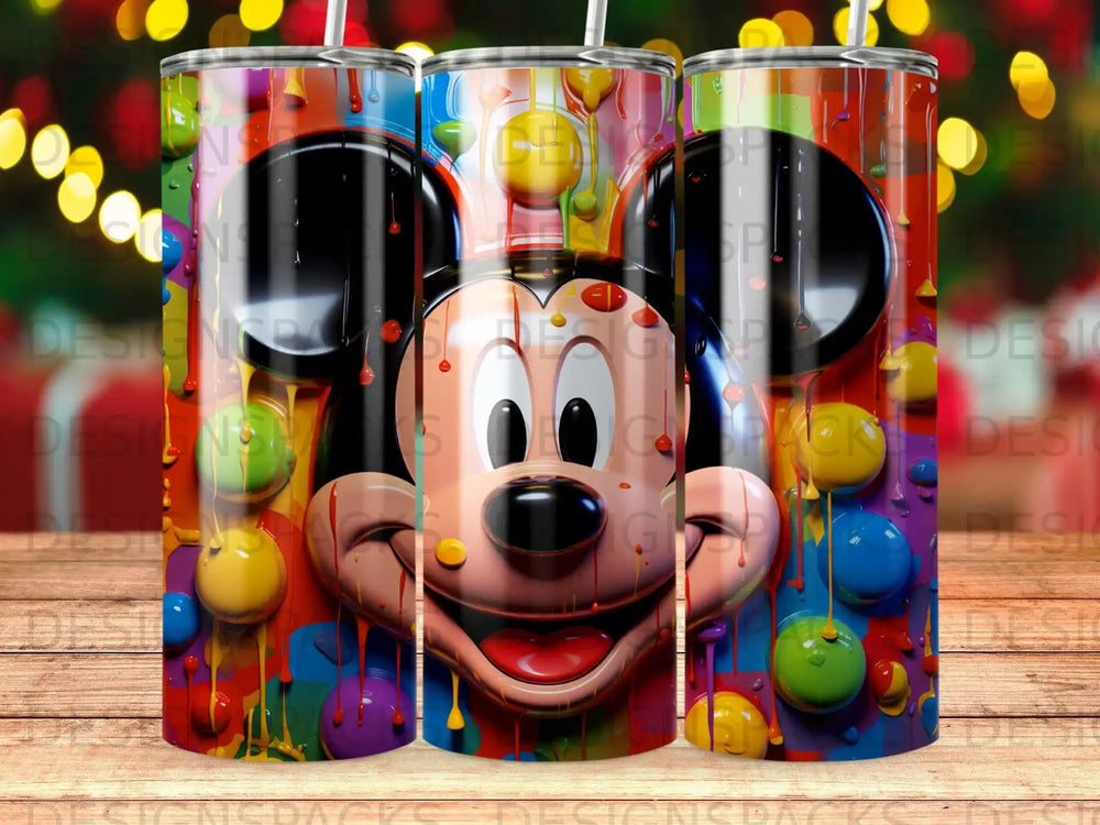 Mickey Mouse face with colorful paint splashes and drips on a tumbler.