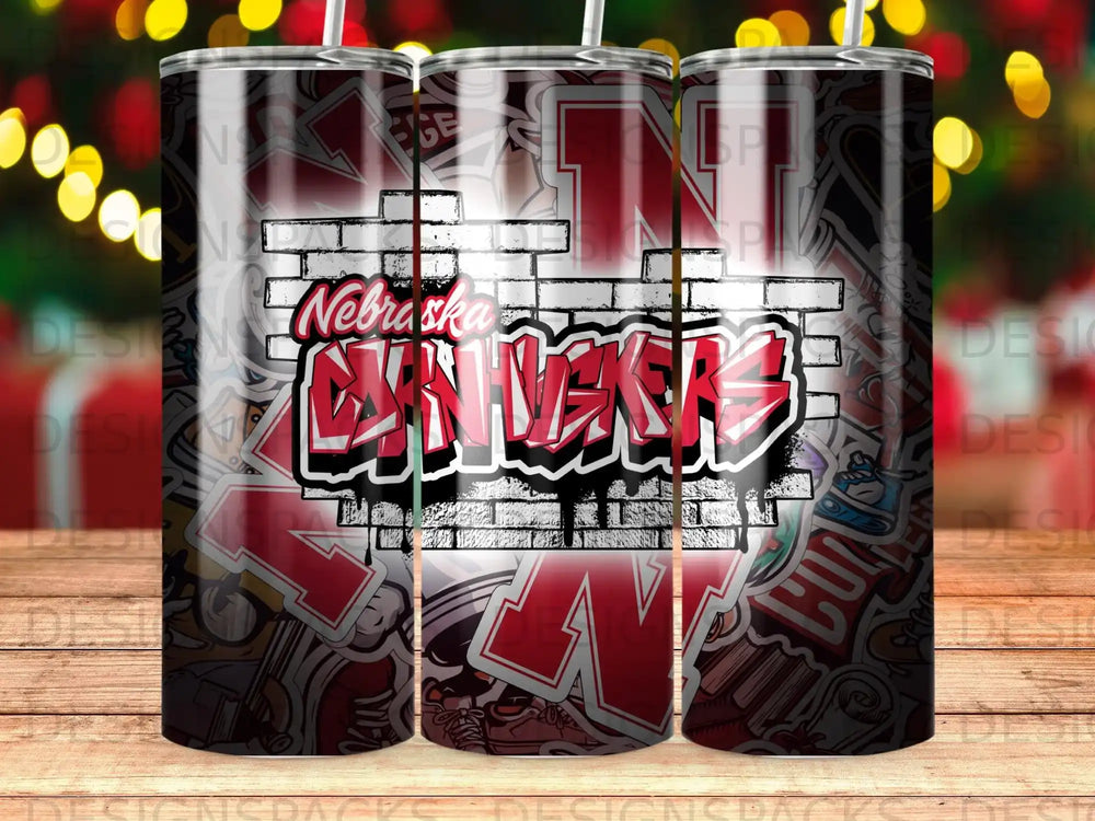 Nebraska Cornhuskers logo on a tumbler with a brick and sticker pattern.