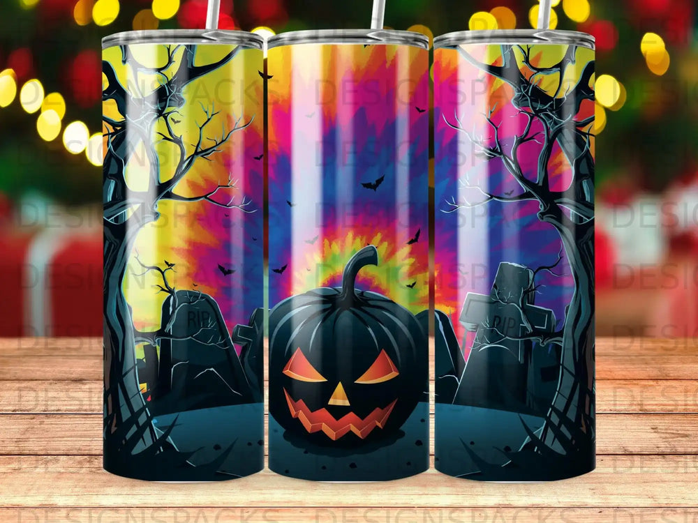 Halloween tumbler with jack-o'-lantern, graves, and tie-dye background.