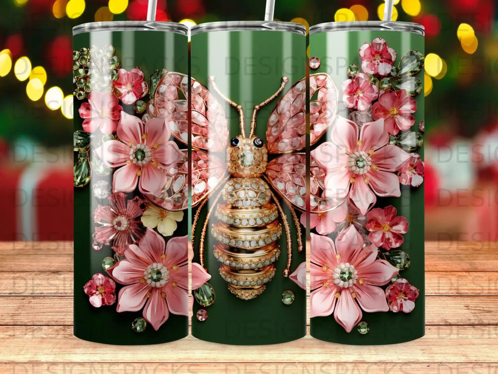 Glittering butterfly with pink floral accents on a dark green patterned tumbler.