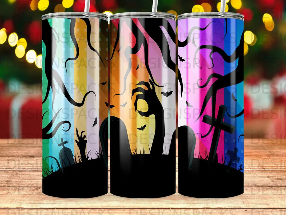 Three Halloween-themed tumblers with spooky graveyard scenes and a zombie hand.