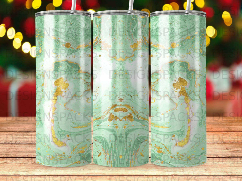 Three tumblers with green and gold marble design and "DESIGNSPACKS" watermark.