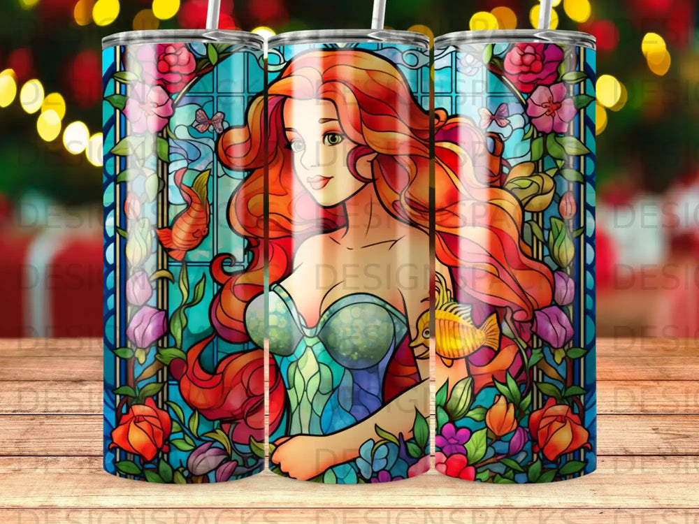 Stained glass mermaid with floral and fish accents.