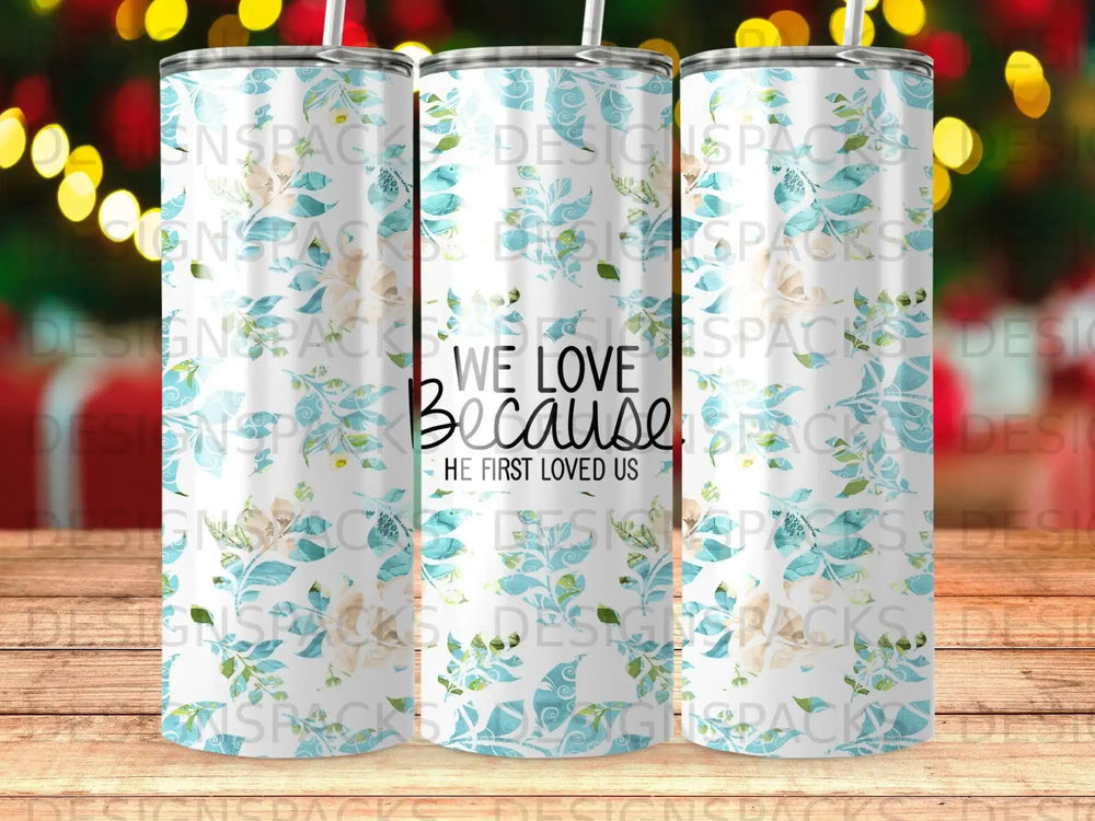 Tumbler with blue and white floral pattern and text "WE LOVE BECAUSE HE FIRST LOVED US".