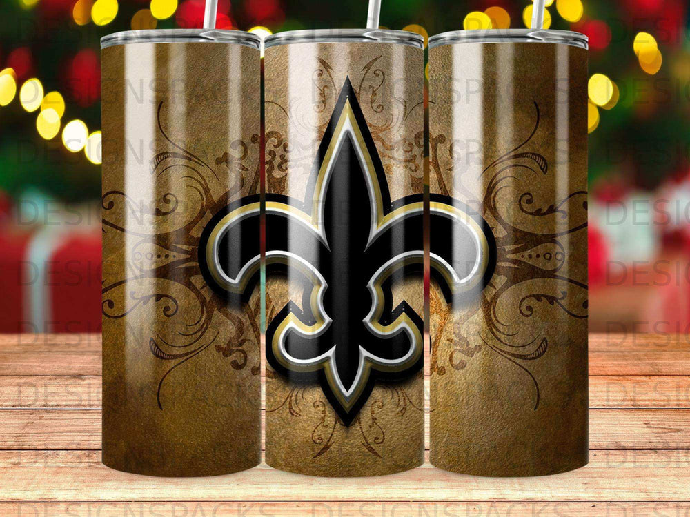 New Orleans Saints fleur-de-lis logo on a rustic brown tumbler with gold scrollwork.