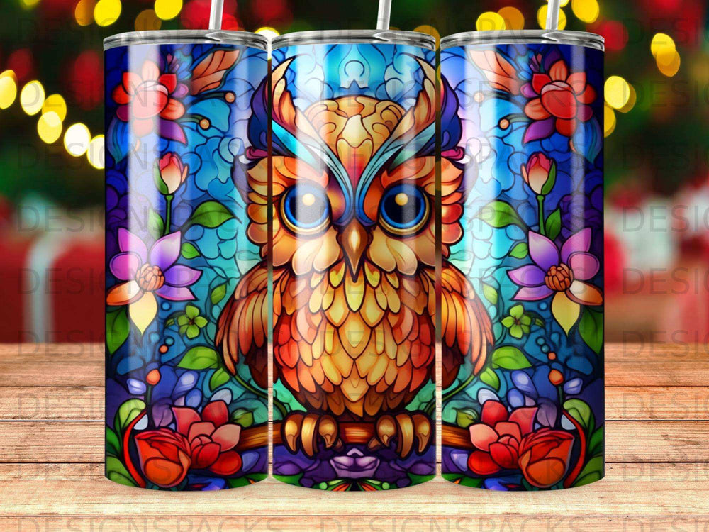 Stained glass owl with floral border on a tumbler.