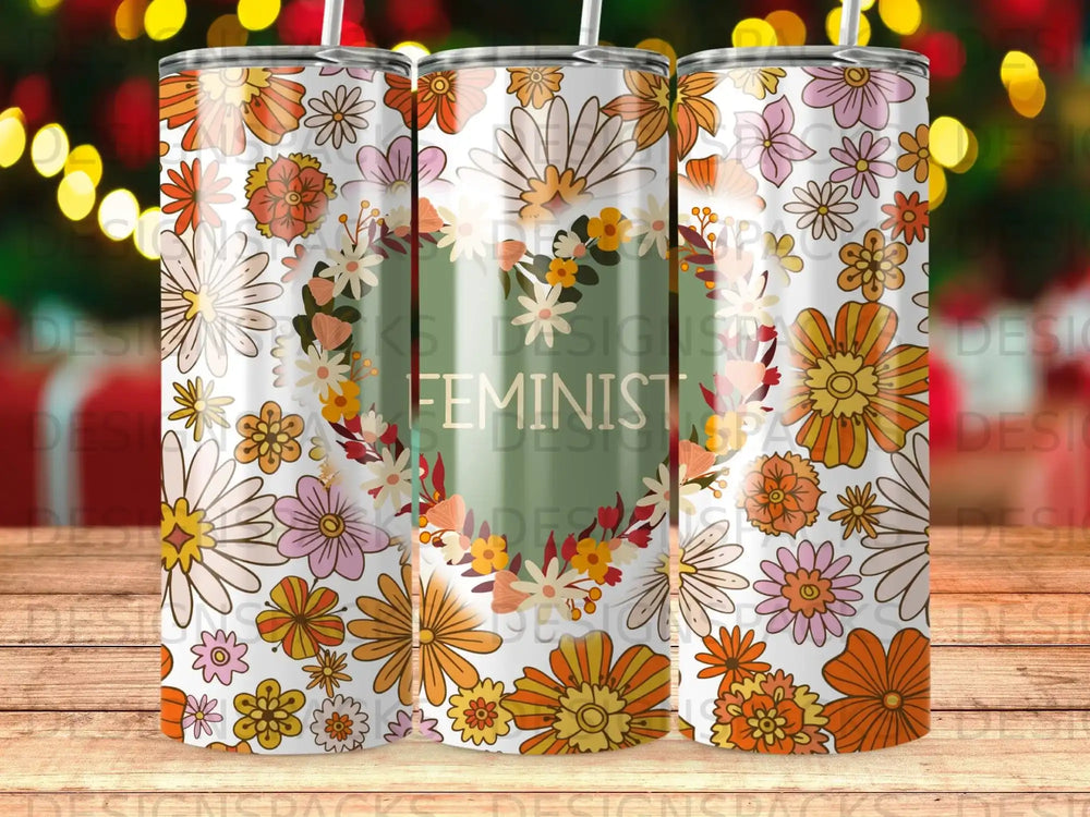 Tumbler with floral wreath design and "FEMINIST" text.