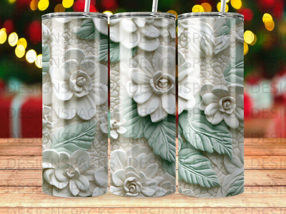 White floral design on a textured tumbler with bokeh lights background.