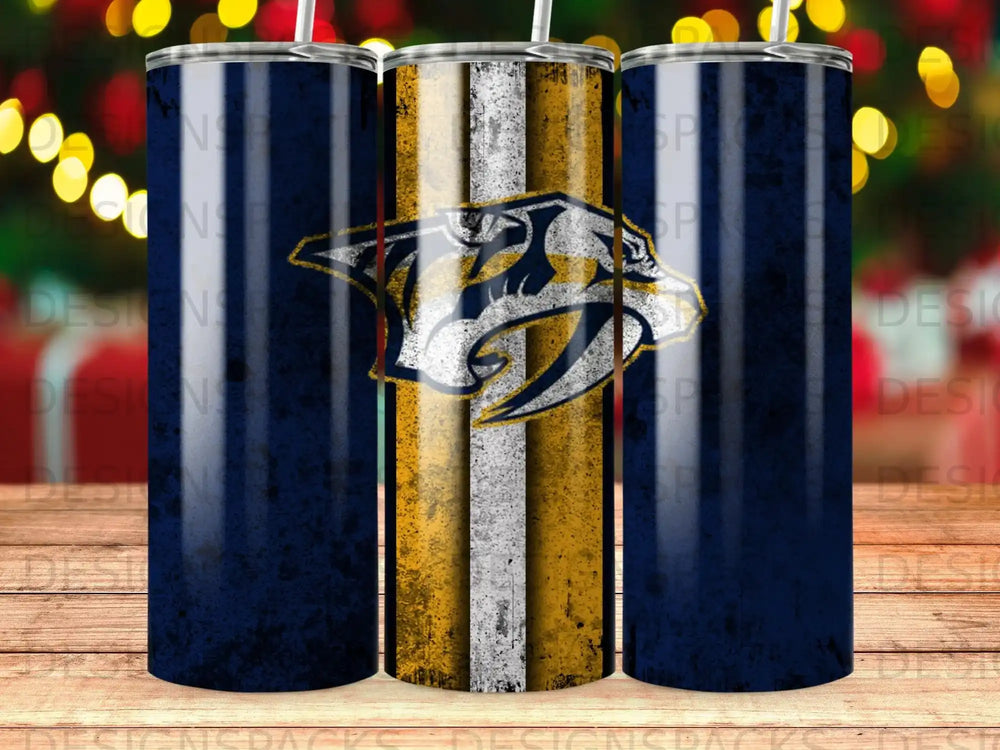 Nashville Predators logo on a navy and gold striped tumbler with bokeh lights.