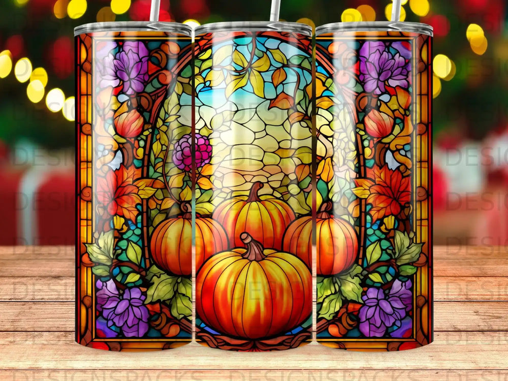 Stained glass tumbler featuring pumpkins and autumn leaves in a window design.
