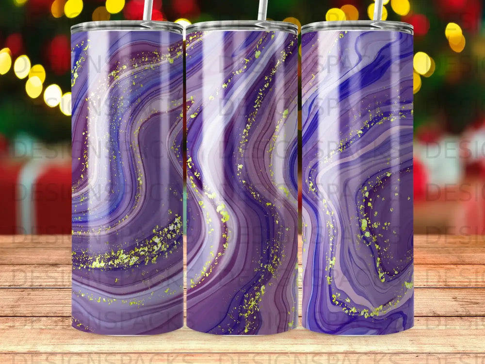 Purple and gold marbled tumbler with blurred bokeh lights in the background.