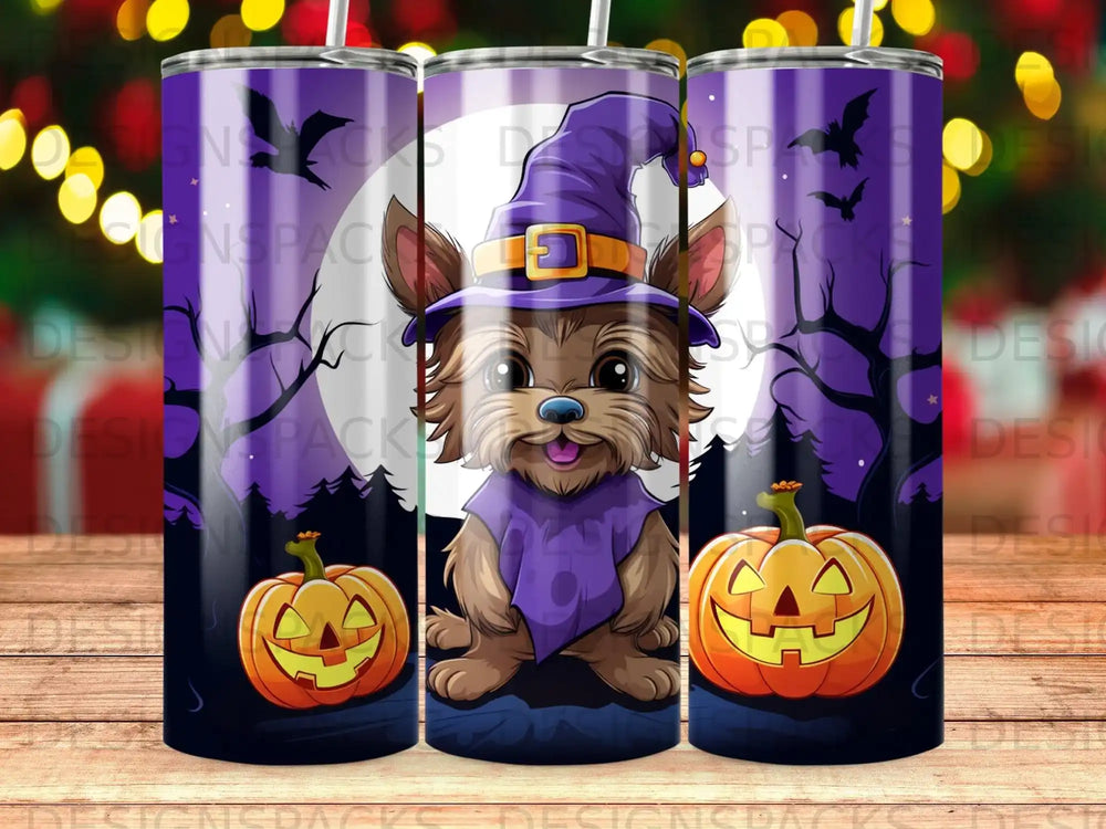 Yorkshire terrier in witch hat with pumpkins and spooky trees.