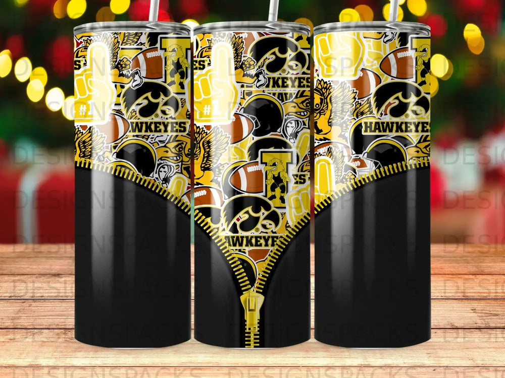 Iowa Hawkeyes tumbler with black and yellow design, featuring football elements and a zipper graphic.