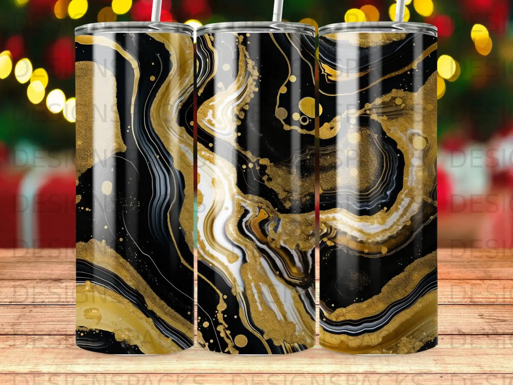 Gold and black marbled tumbler with straw.