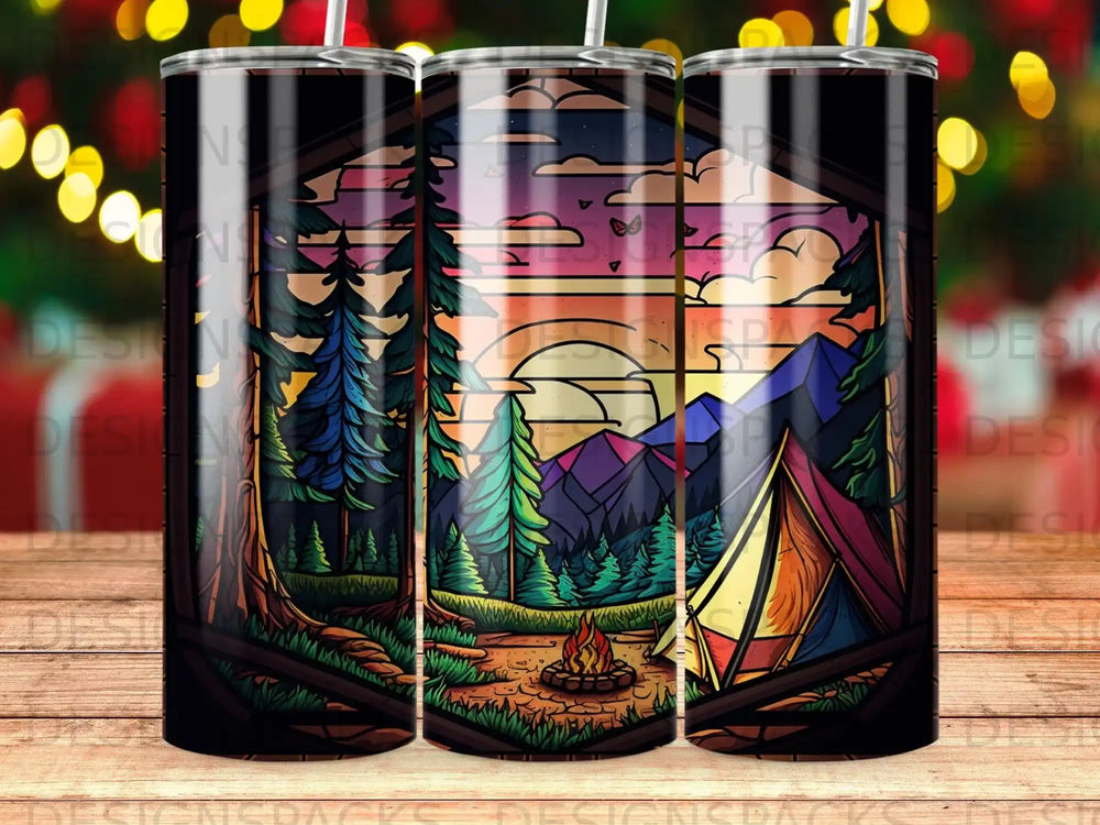 Tent, campfire, and mountains viewed through a wooden frame at sunset.