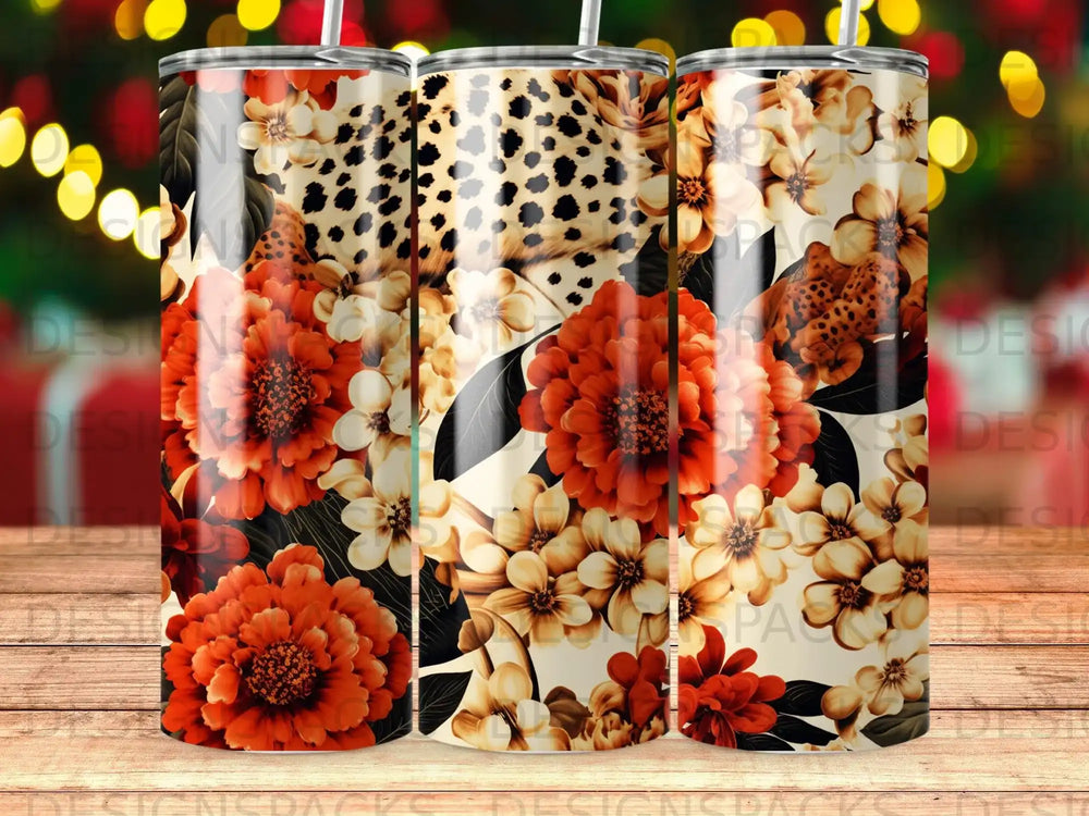 Three tumblers with floral and leopard print designs in warm tones.