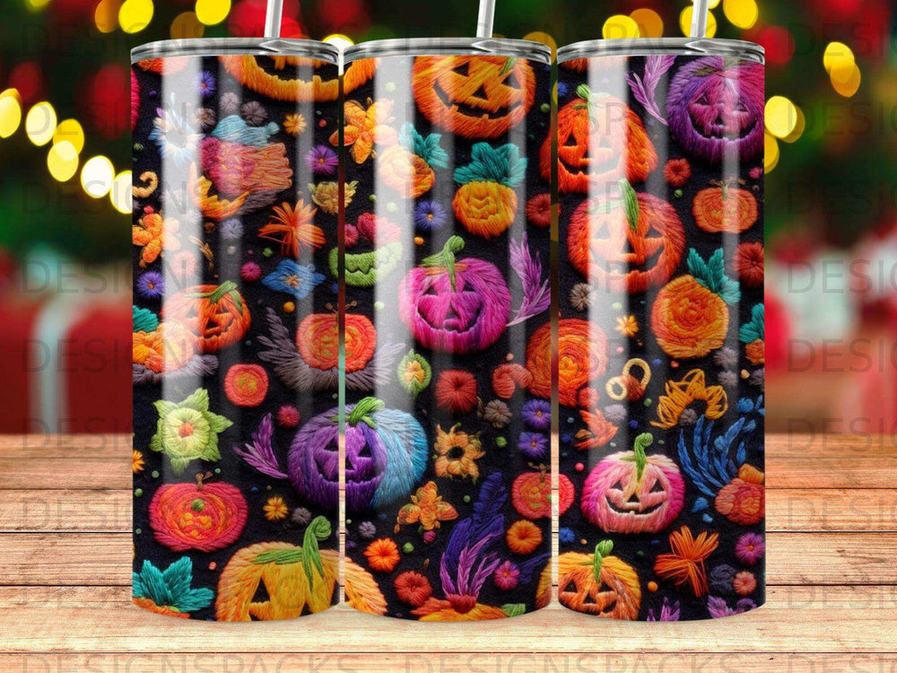 Halloween-themed tumblers with jack-o'-lanterns, pumpkins, and floral patterns.