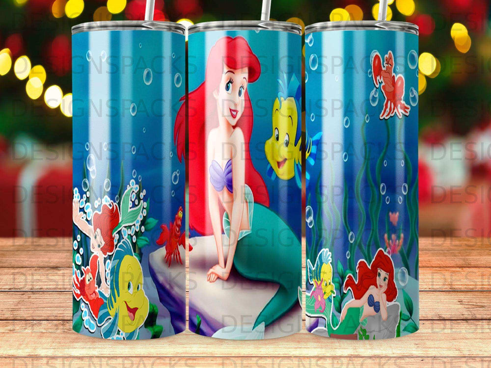 Ariel the mermaid with Flounder and Sebastian on a tumbler.
