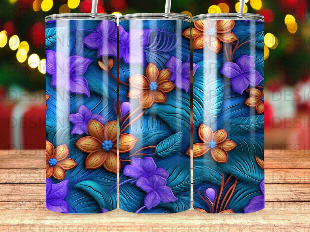 Blue tumbler with purple and orange flowers and teal leaves.