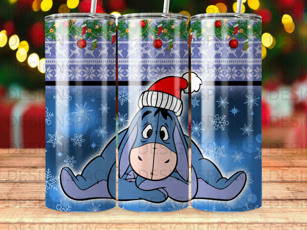 Eeyore in a Santa hat lies on a blue patterned background.