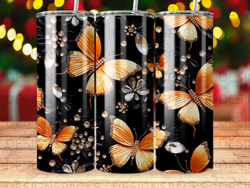Black tumbler with shimmering orange butterflies and jewel accents.