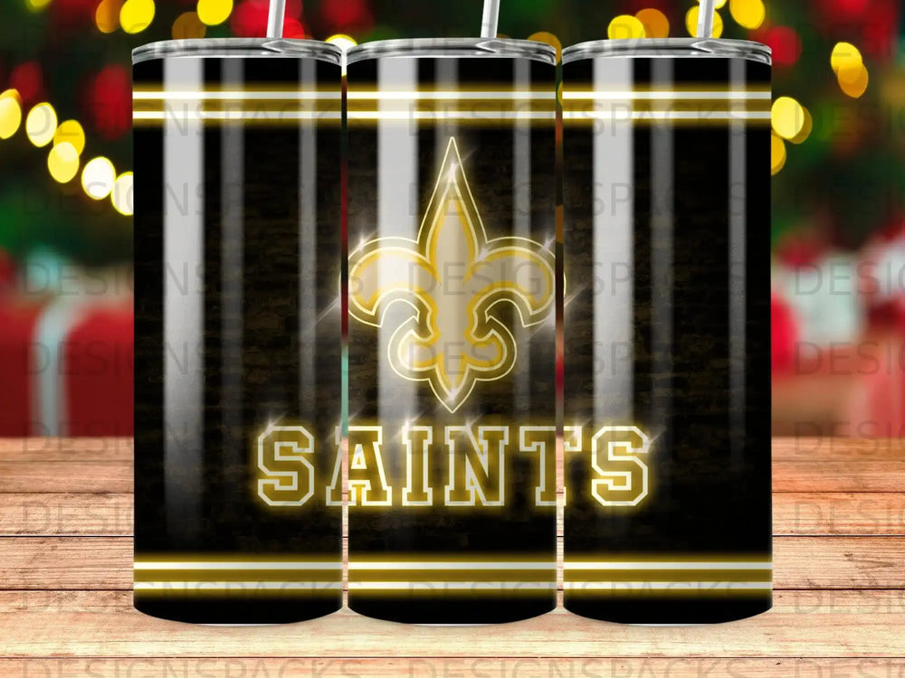 New Orleans Saints logo and wordmark on a black and gold tumbler.