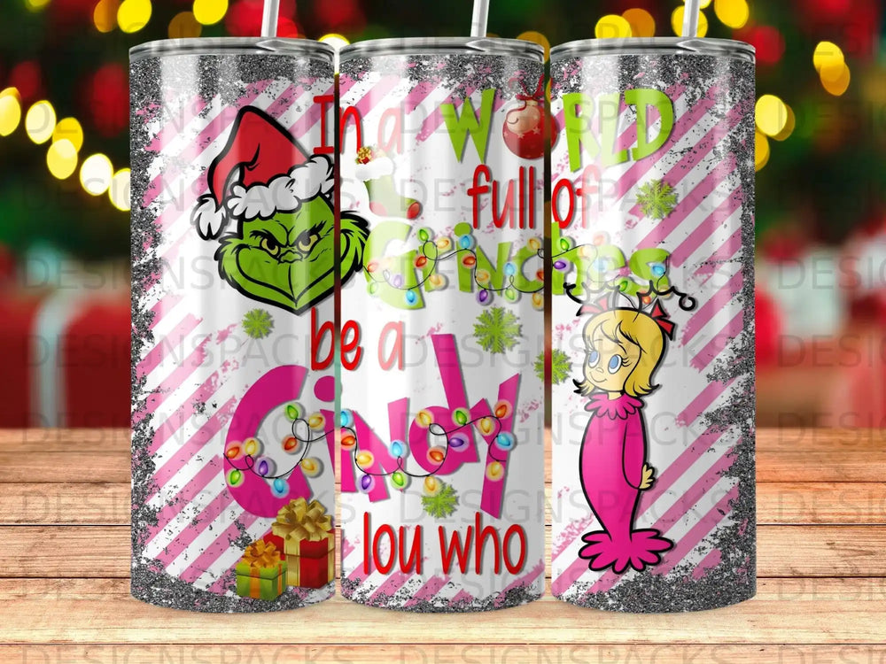 The Grinch and Cindy Lou Who on a pink and white striped tumbler.