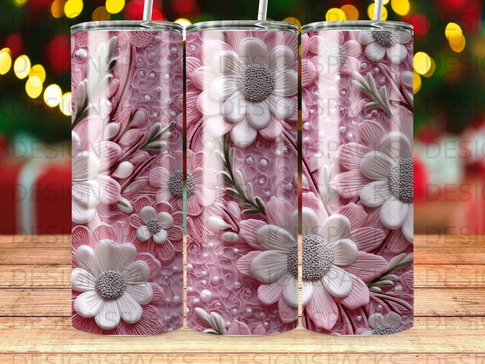Pink tumbler with white floral and textured patterns.