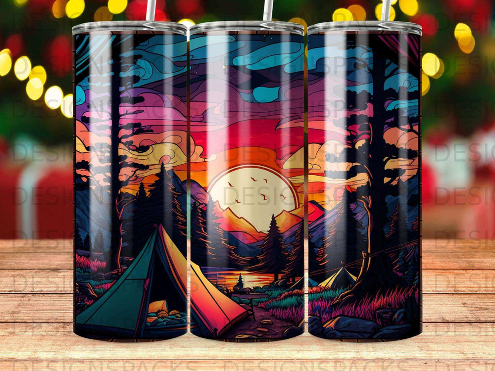 Sunset campsite scene with tents and mountains on a colorful tumbler.