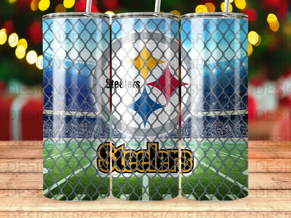 Pittsburgh Steelers logo on a tumbler with a stadium and fence background.
