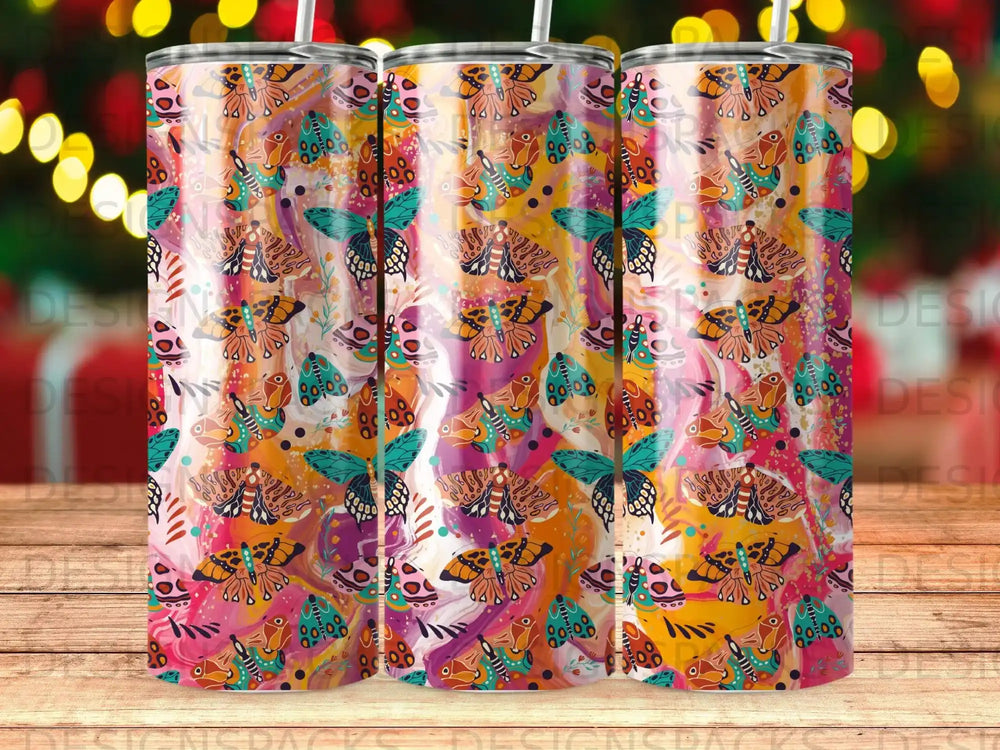 Three tumblers with a colorful butterfly and floral pattern.