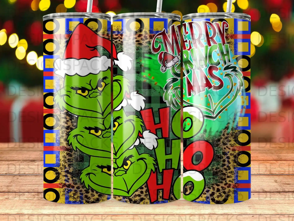 Grinch face with "Merry Grinchmas" text on tumbler with colorful patterns.