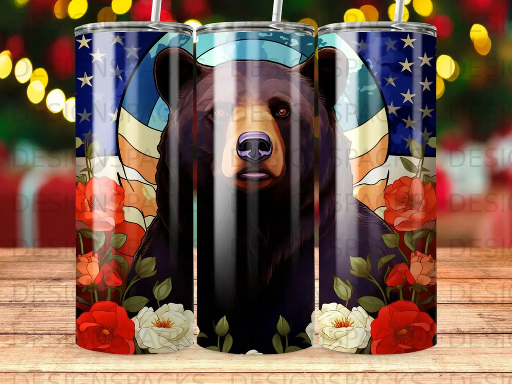 Black bear with American flag and flowers on a tumbler.