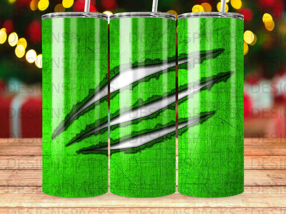 Green tumbler with three claw marks and a scratched wood texture background.