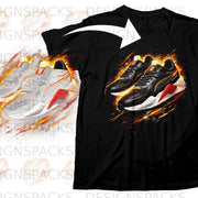 Black t-shirt with a graphic design of two Puma sneakers in vibrant colors.