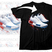 Black t-shirt with a graphic of white Adidas sneakers with red and blue paint splatters.