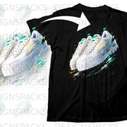 Black t-shirt with white Puma sneakers featuring green accents and abstract paint splatters.